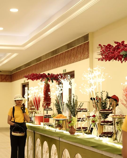 Long olive and gold buffet counter set out in a hotel banquet hall